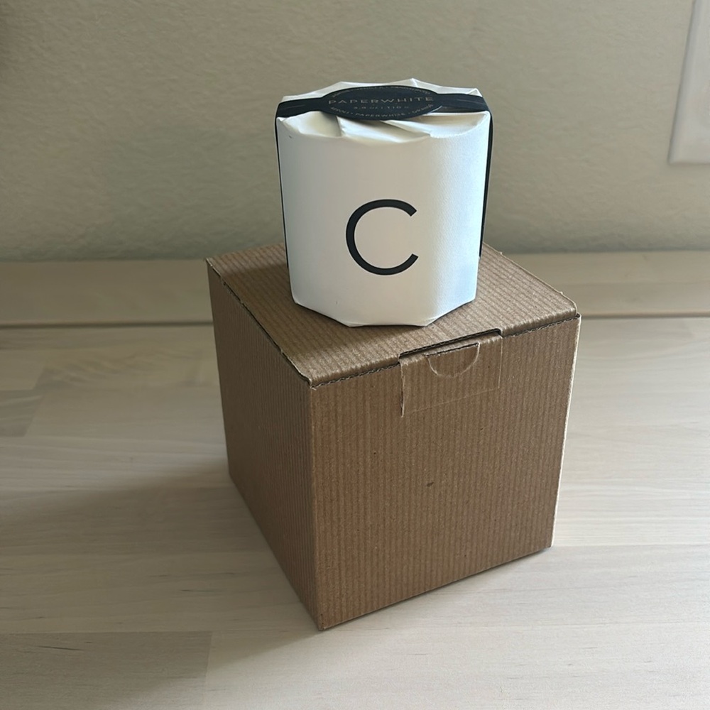 Pottery Barn Paperwhite scented “C” glass votive candle